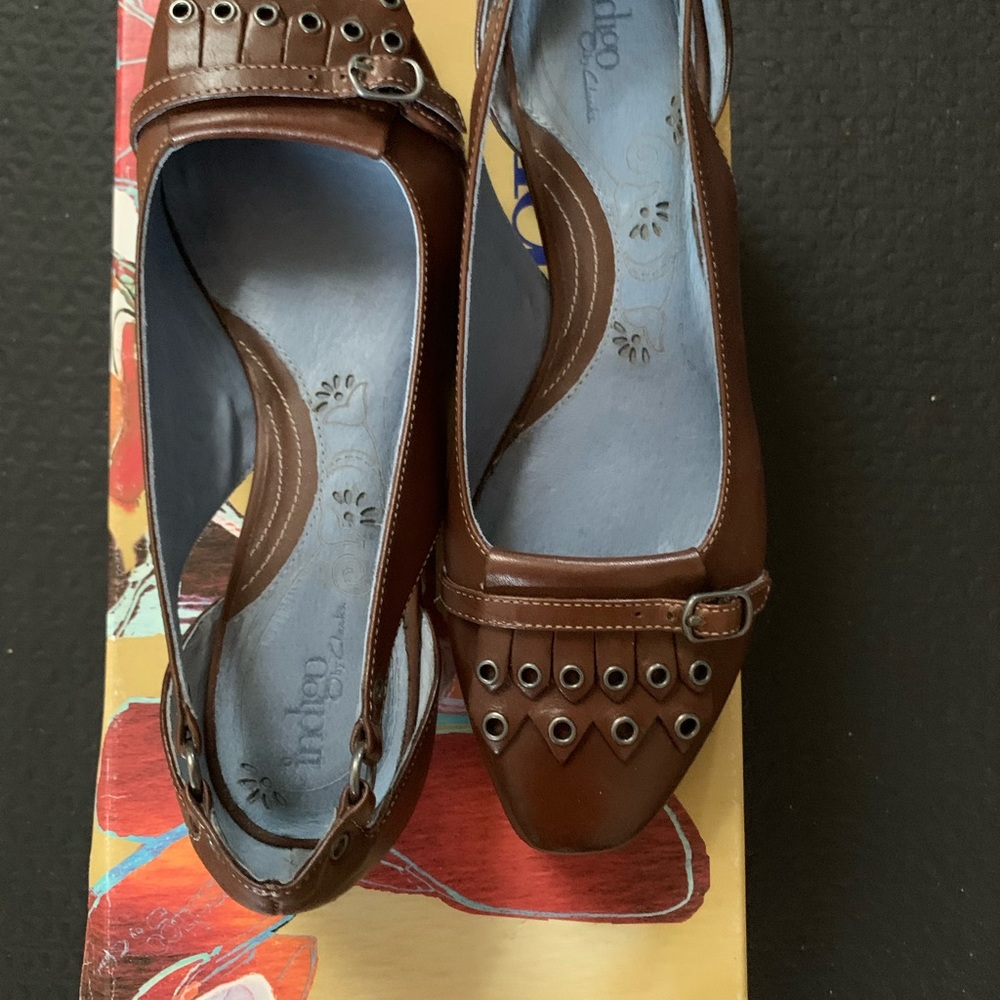 Brown flats by indigo size 6